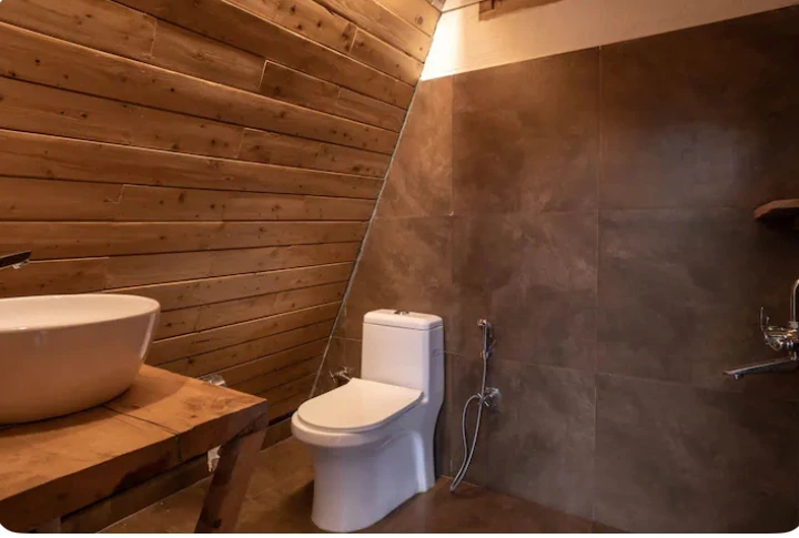 Modern bathroom in luxury A-frame cottage Jibhi