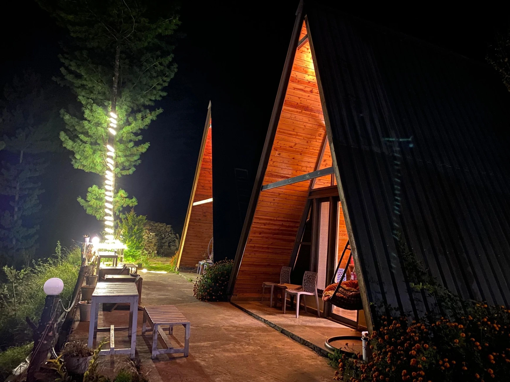 Cozy wooden interior of A-frame cottage in Jibhi