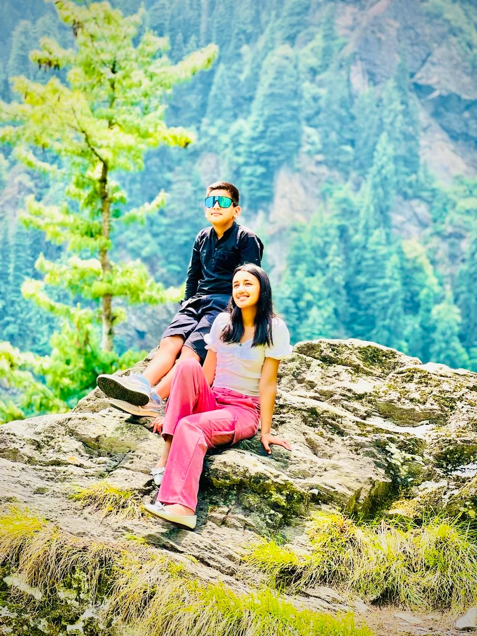 Cozy living space inside two-room cottage in Jibhi